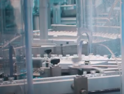 An assembly line of vaccine vials