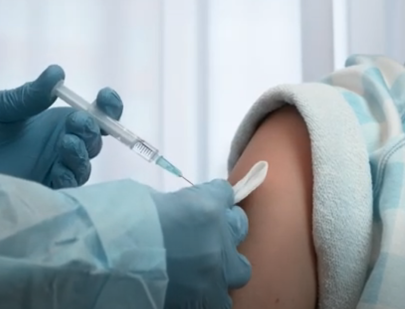 A person receives an intramuscular injection