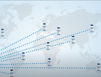 Vaccine vials are shown in multiple spots on a world map